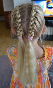 two french braids near the middle parting